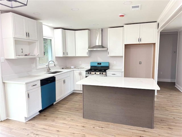 3805 Purdue Dr, Metairie, LA 70003 - kitchen with wall chimney range hood, stainless steel gas range, a sink, dishwashing machine, and light wood finished floors