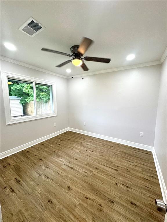 3805 Purdue Dr, Metairie, LA 70003 - spare room with ornamental molding, wood finished floors, baseboards, a ceiling fan, and recessed lighting