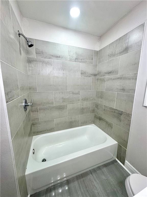 3805 Purdue Dr, Metairie, LA 70003 - full bath featuring toilet, wood finished floors, and shower / tub combination