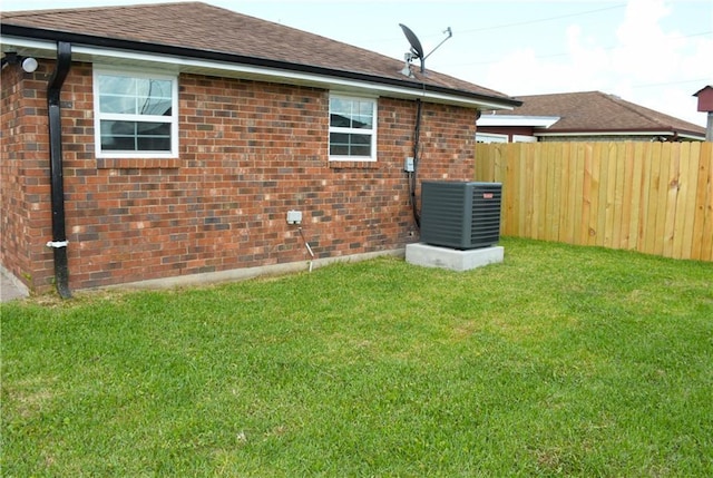 6 Marywood Ct, New Orleans, LA 70128 - rear view of property with cooling unit, brick siding, and roof with shingles