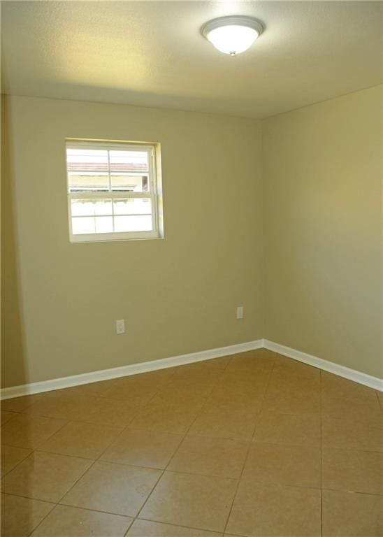 6 Marywood Ct, New Orleans, LA 70128 - spare room featuring light tile patterned floors and baseboards
