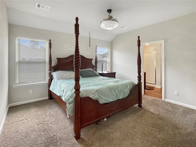75616 Sylvia Dr, Covington, LA 70435 - bedroom featuring carpet flooring, baseboards, vaulted ceiling, and ensuite bath