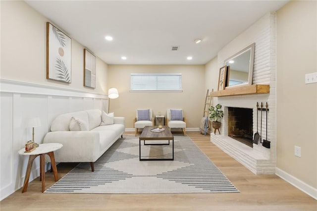 4912 Ithaca St, Metairie, LA 70006 - living area with wood finished floors, a fireplace, recessed lighting, and baseboards