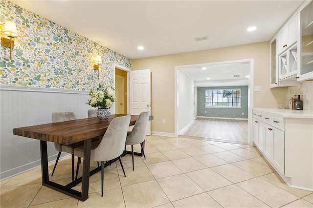 4912 Ithaca St, Metairie, LA 70006 - dining space featuring wallpapered walls, a wainscoted wall, recessed lighting, baseboards, and light tile patterned floors