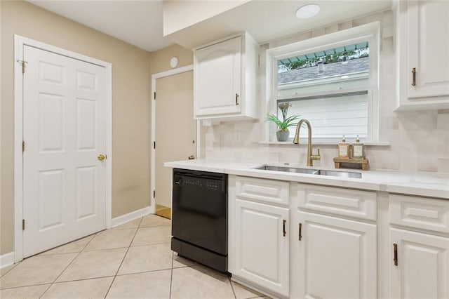 4912 Ithaca St, Metairie, LA 70006 - kitchen with black dishwasher, a sink, tasteful backsplash, and white cabinets