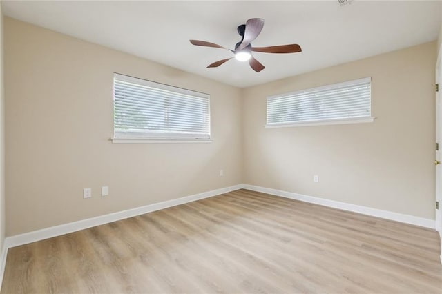 4912 Ithaca St, Metairie, LA 70006 - empty room featuring light wood-style flooring, baseboards, and a ceiling fan