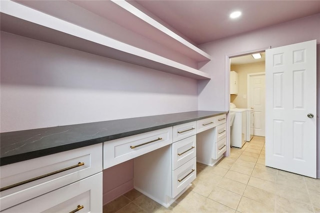 4912 Ithaca St, Metairie, LA 70006 - unfurnished office with independent washer and dryer, built in desk, light tile patterned flooring, and recessed lighting