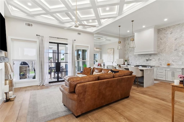 1600 Heatherwood Dr, Harvey, LA 70058 - living room with light wood finished floors, beam ceiling, french doors, coffered ceiling, and recessed lighting