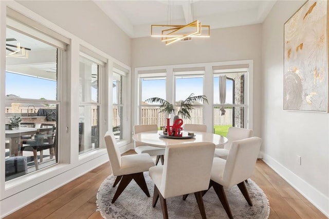 1600 Heatherwood Dr, Harvey, LA 70058 - dining area featuring hardwood / wood-style floors, a chandelier, and baseboards