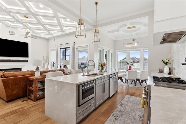 1600 Heatherwood Dr, Harvey, LA 70058 - kitchen featuring a sink, coffered ceiling, appliances with stainless steel finishes, gray cabinets, and open floor plan