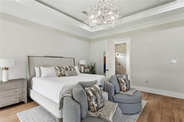 1600 Heatherwood Dr, Harvey, LA 70058 - bedroom featuring a chandelier, wood-type flooring, ornamental molding, a tray ceiling, and baseboards