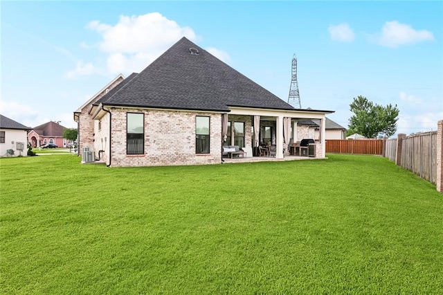 1600 Heatherwood Dr, Harvey, LA 70058 - back of property with a shingled roof, a patio, central AC unit, and brick siding