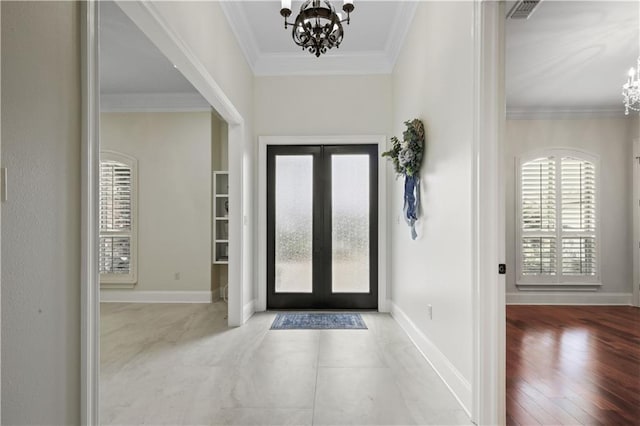 1125 Lakeshore Blvd, Slidell, LA 70461 - foyer featuring a chandelier, french doors, ornamental molding, and baseboards