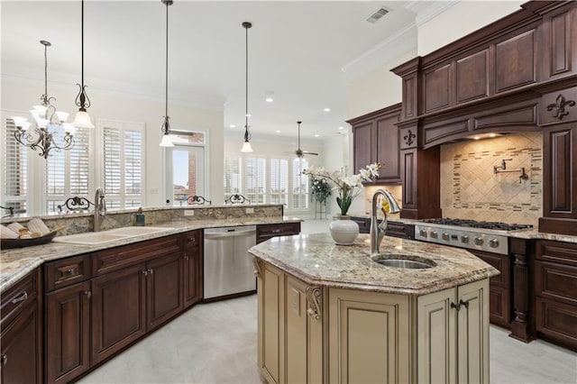 1125 Lakeshore Blvd, Slidell, LA 70461 - kitchen featuring appliances with stainless steel finishes, a sink, tasteful backsplash, light stone countertops, and ornamental molding