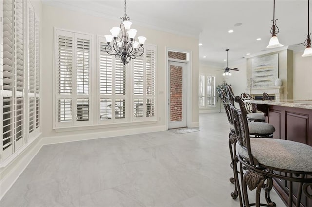 1125 Lakeshore Blvd, Slidell, LA 70461 - dining room with ornamental molding, ceiling fan, a chandelier, baseboards, and recessed lighting