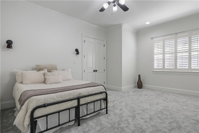 1125 Lakeshore Blvd, Slidell, LA 70461 - carpeted bedroom featuring crown molding, baseboards, ceiling fan, and a closet