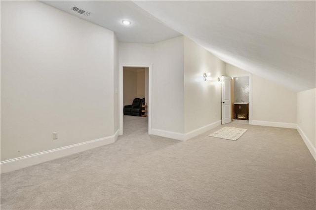 1125 Lakeshore Blvd, Slidell, LA 70461 - bonus room featuring light carpet, lofted ceiling, baseboards, and recessed lighting