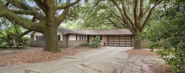 110 Willow Dr, Covington, LA 70433 - view of front of home with a garage, driveway, and brick siding