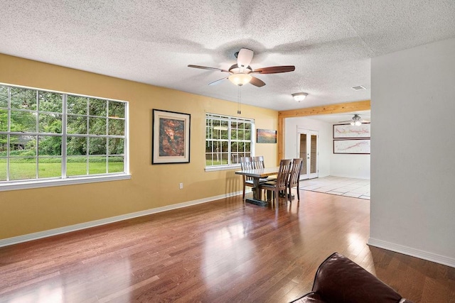 110 Willow Dr, Covington, LA 70433 - dining space with ceiling fan, baseboards, wood finished floors, and a textured ceiling