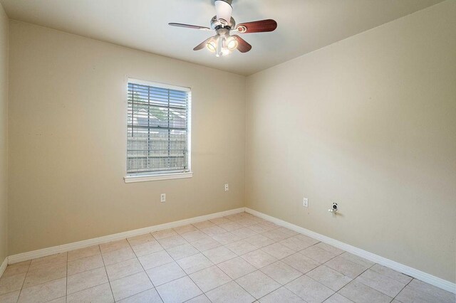 110 Willow Dr, Covington, LA 70433 - unfurnished room with ceiling fan, light tile patterned floors, and baseboards