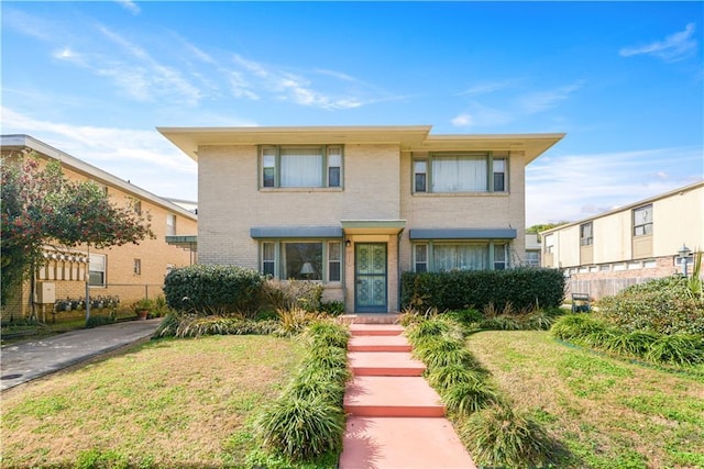 7356 Cameo St, New Orleans, LA 70124 - view of front of home featuring brick siding and a front yard