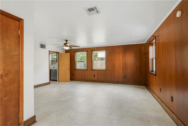 7356 Cameo St, New Orleans, LA 70124 - empty room with a ceiling fan, baseboards, and wooden walls
