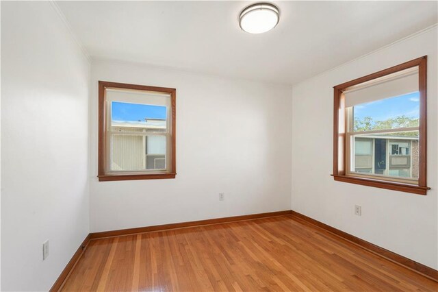 7356 Cameo St, New Orleans, LA 70124 - unfurnished room featuring light wood finished floors, baseboards, and crown molding