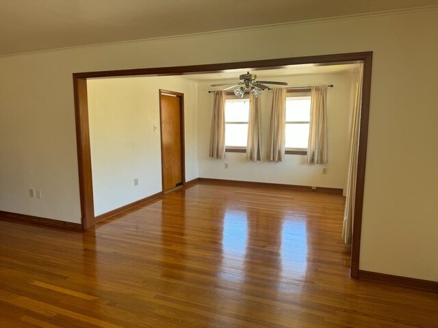7356 Cameo St, New Orleans, LA 70124 - spare room featuring wood finished floors, baseboards, ceiling fan, and crown molding