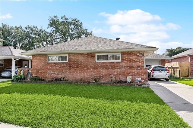 3221 Metairie Heights Ave, Metairie, LA 70002 - view of front of home with an attached garage, brick siding, a front lawn, concrete driveway, and roof with shingles