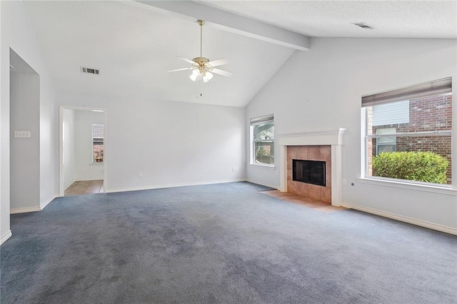 768 Wilkinson St, Mandeville, LA 70448 - unfurnished living room with a ceiling fan, beamed ceiling, carpet, baseboards, and a tile fireplace