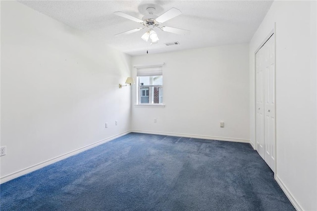 768 Wilkinson St, Mandeville, LA 70448 - unfurnished bedroom featuring a textured ceiling, carpet flooring, baseboards, a ceiling fan, and a closet