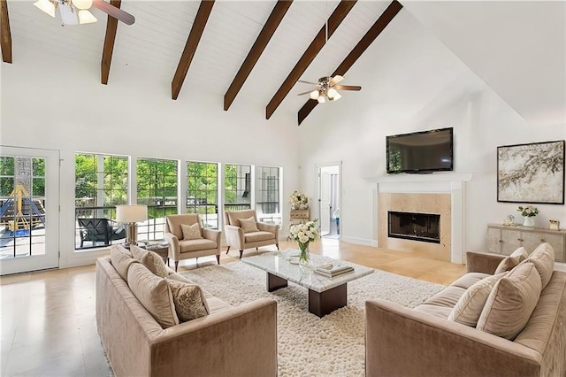 114 Kendrick Dr, Slidell, LA 70461 - living room with ceiling fan, high vaulted ceiling, a tile fireplace, healthy amount of natural light, and beam ceiling