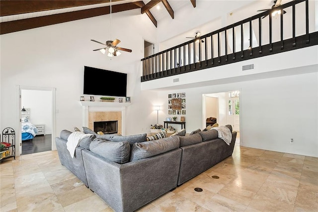 114 Kendrick Dr, Slidell, LA 70461 - living area with a ceiling fan, a fireplace, high vaulted ceiling, and beamed ceiling
