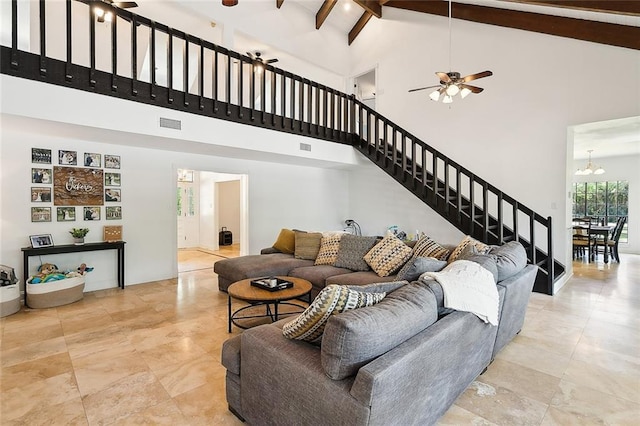 114 Kendrick Dr, Slidell, LA 70461 - living room with high vaulted ceiling, stairway, a ceiling fan, beam ceiling, and a chandelier