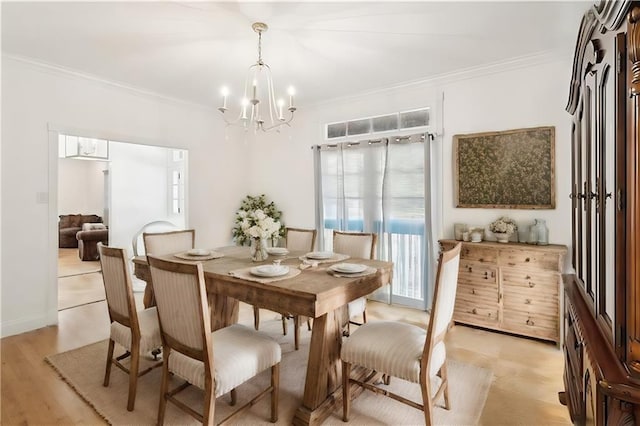 114 Kendrick Dr, Slidell, LA 70461 - dining room with a chandelier, ornamental molding, and light wood-type flooring