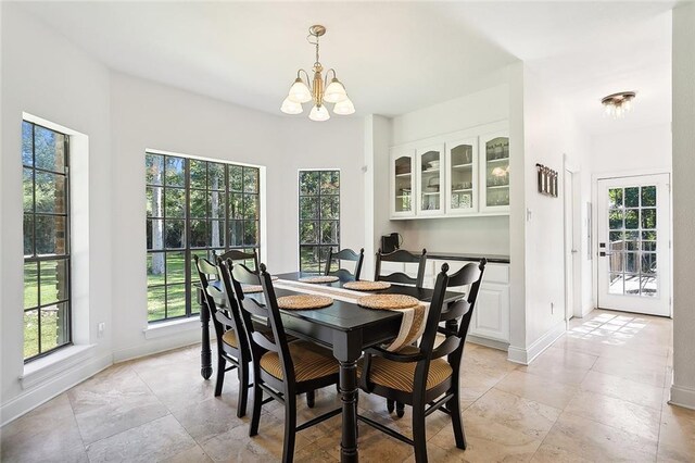 114 Kendrick Dr, Slidell, LA 70461 - dining area with healthy amount of natural light and a chandelier