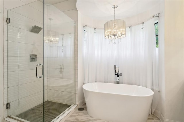 114 Kendrick Dr, Slidell, LA 70461 - full bathroom featuring marble finish flooring, a chandelier, a shower stall, and a soaking tub