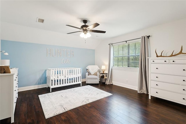 114 Kendrick Dr, Slidell, LA 70461 - bedroom featuring wood finished floors, a nursery area, vaulted ceiling, and a ceiling fan