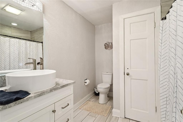 114 Kendrick Dr, Slidell, LA 70461 - bathroom featuring vanity, a closet, a textured wall, and a shower with shower curtain