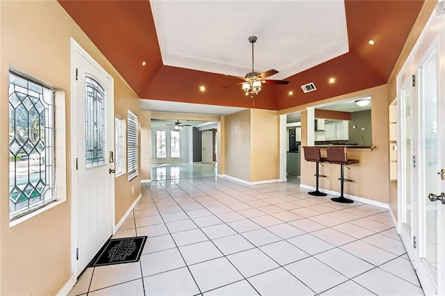 3500 Silver Maple Ct, New Orleans, LA 70131 - entrance foyer with a ceiling fan, light tile patterned flooring, baseboards, and a raised ceiling
