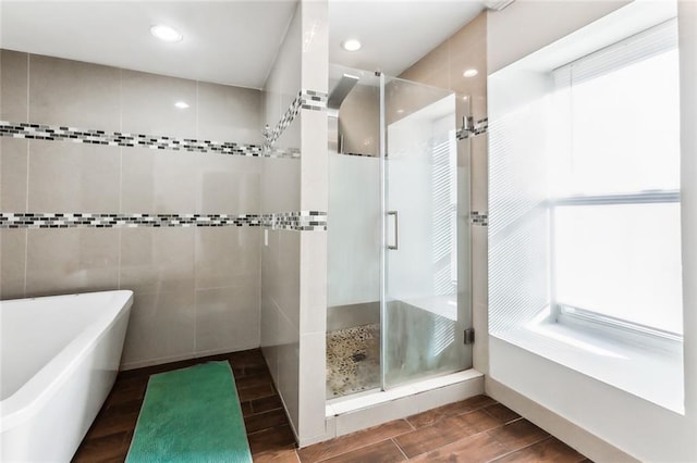 3500 Silver Maple Ct, New Orleans, LA 70131 - full bath featuring a stall shower, a soaking tub, wood finish floors, and recessed lighting