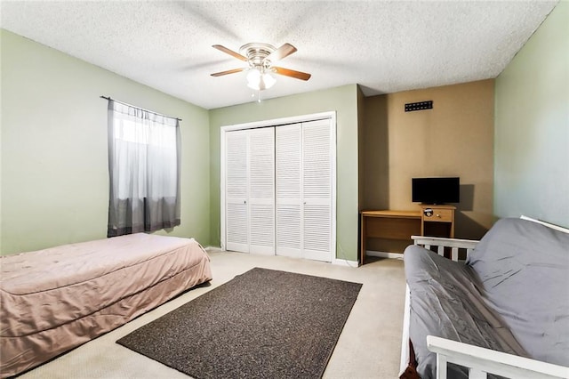 3500 Silver Maple Ct, New Orleans, LA 70131 - carpeted bedroom featuring a closet, a textured ceiling, and ceiling fan