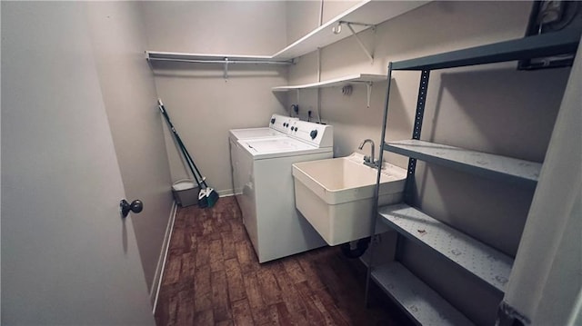 1217 Olde Oaks Dr, Westwego, LA 70094 - washroom featuring dark wood-type flooring, washer and clothes dryer, pet washing area, and baseboards