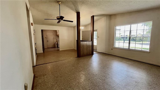 365 Cottage Ct, La Place, LA 70068 - unfurnished room with baseboards, ceiling fan, lofted ceiling, and a textured ceiling