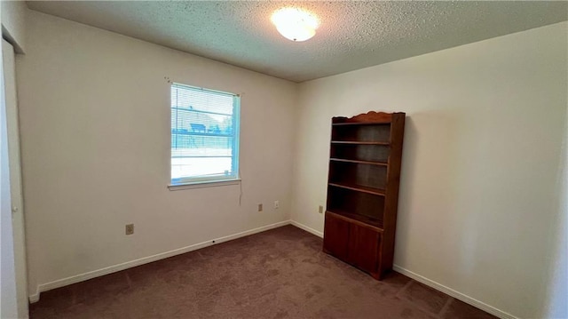 365 Cottage Ct, La Place, LA 70068 - carpeted spare room featuring a textured ceiling and baseboards
