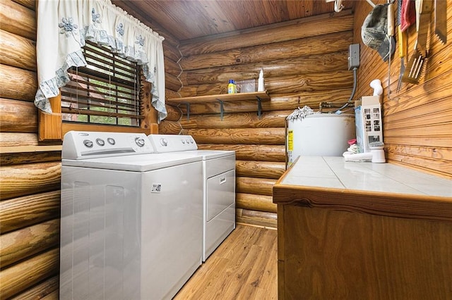 138 Ned Ave, Slidell, LA 70460 - washroom featuring separate washer and dryer, water heater, rustic walls, light wood-style floors, and wood ceiling