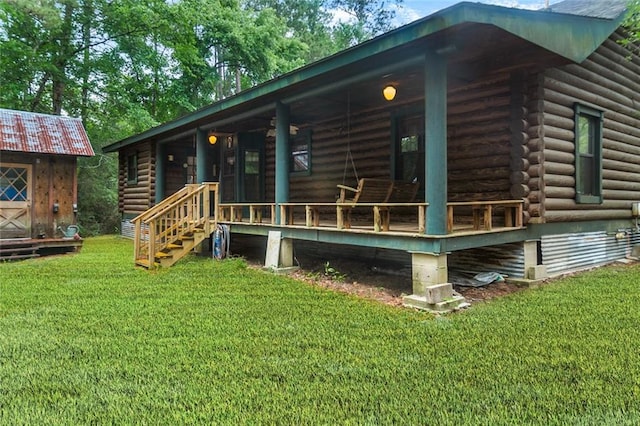 138 Ned Ave, Slidell, LA 70460 - rear view of house with log exterior and a lawn