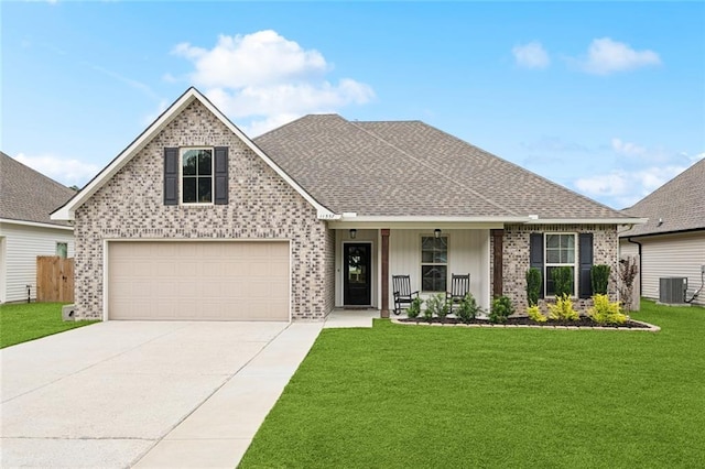 11557 Woodbluff Dr, Covington, LA 70433 - view of front of house with cooling unit, a porch, a front yard, brick siding, and driveway