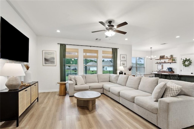 11557 Woodbluff Dr, Covington, LA 70433 - living area with a ceiling fan, light wood-style floors, recessed lighting, a chandelier, and baseboards