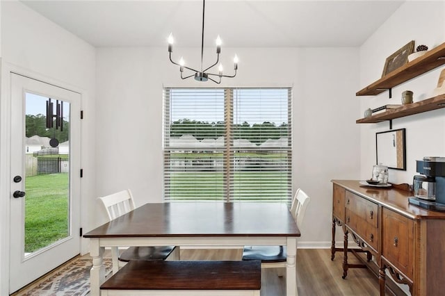 11557 Woodbluff Dr, Covington, LA 70433 - dining area featuring plenty of natural light, a chandelier, and wood finished floors